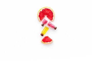 Natural citrus cosmetics. Spa salt near grapefruit on white background top view copy space