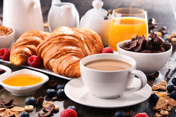 Breakfast served with coffee, juice, croissants and fruits