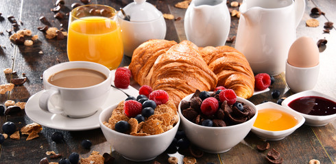 Breakfast served with coffee, juice, croissants and fruits