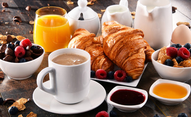 Breakfast served with coffee, juice, croissants and fruits