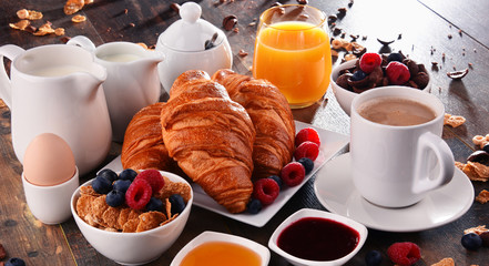 Breakfast served with coffee, juice, croissants and fruits