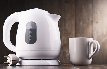 White plastic electric kettle on the table