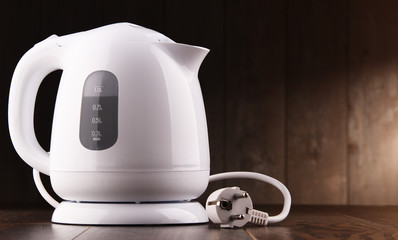 White plastic electric kettle on the table
