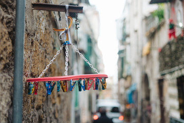 old white plastic clothespins hang