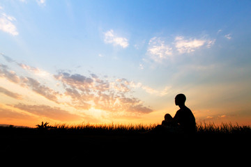 Human trafficking, Children sitting at sunset sky.