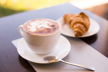 Food. Cappuccino and croissant