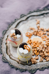 Cheesecake in the jar with peonies on the antique plate