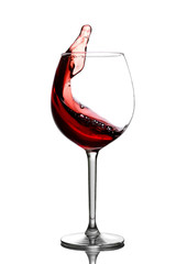 Splash in red wine in a glass