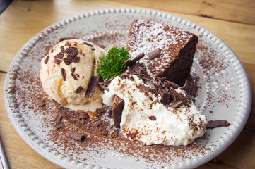 ice cream Vanilla chocolate pie whippin creamy tasty dessert on wood table in cafe ready to eat in restaurant.
