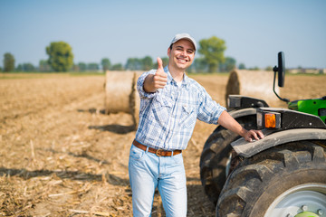 Smiling farmer giving thumbs up