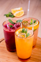 Berry lemonades with ice and leaves of mint