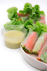 Healthy fresh vegetable salad roll with seafood and noodle, clean food for weight loss on white background, selective focus.