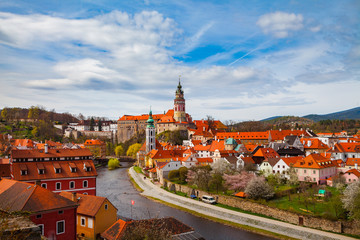 Naklejka na ściany i meble Aerial view of old town of Cesky Krumlov witth the castle tower, Czech republic. Bright spring time.