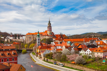 Fototapeta na wymiar Cesky Krumlov. Cityscape with Castle Tower, sunny spring day. Czech republic.