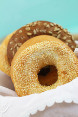 Selection of freshly baked bagels in bread basket with copy space
