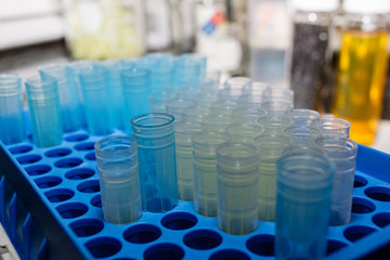 A yellow  and blue disposable micro pipette tips for lab or laboratory in plastic holder