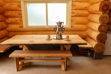 Wooden table in a wooden house / Samovar