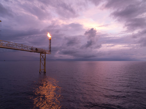 Fire On Flare Blow Out In Offshore Oil And Gas Central Processing Platform And Remote Platform Produced Oil, Natural Gas And Liquid Condensate For Set To Onshore Refinery From Offshore In Ocean Sea.