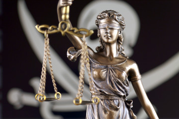Symbol of law and justice with Pirate Flag.