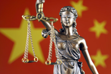 Symbol of law and justice with China Flag. Close up.