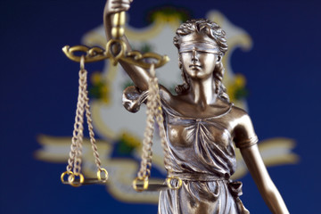 Symbol of law and justice with Connecticut State Flag. Close up.