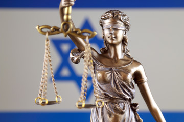Symbol of law and justice with Israel Flag. Close up.