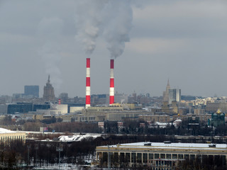 Pipes and smoke over the city. Ecology and air pollution concept