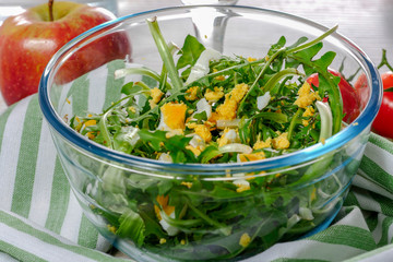 dandelion salad in a glass bowl