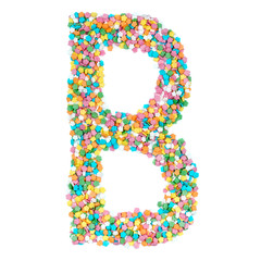 English alphabet letters, numerals and symbols made of little candies