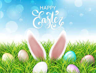 Colorful Easter eggs and rabbit ears sticking out of the grass. Spring landscape with blue sky. Greetig card template. Spring easter design