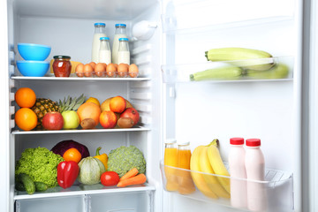 Open fridge full of vegetables and fruits © 5second
