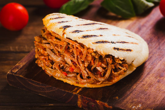 Freshly cooked Arepa with roasted meat