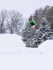 People are having fun in downhill skiing and snowboarding