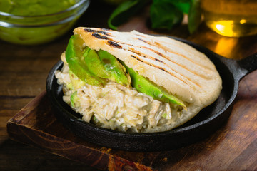 Reina pepeada, Arepa, corn bread with chicken and avocado