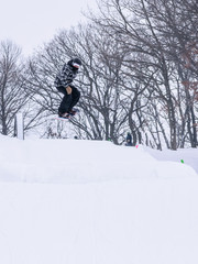 People are having fun in downhill skiing and snowboarding