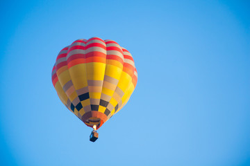 Colorful hot air balloon fly over the blue sky