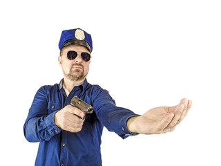 The duty policeman directs a special operation with a weapon in his hand