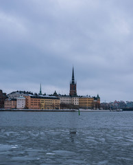 Fototapeta na wymiar View of the Swedish architecture, whilst the river is freezing