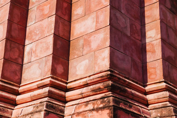 Close up of Thailand ancient red brick wall sand stone in temple for south east asia temple texture background