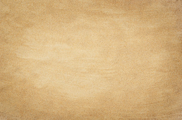 Fototapeta na wymiar Top view of sandy beach. Background with copy space and visible sand texture.