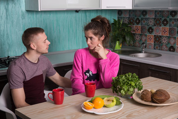 Attractive couple resting in the kitchen 