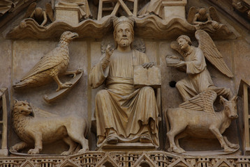 Gothic tympanum with Christ in Majesty and Four Evangelists in Burgos cathedral, Spain - obrazy, fototapety, plakaty