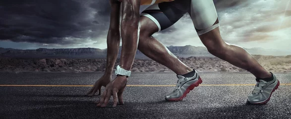 Gordijnen Sports background. Runner feet running on road closeup on shoe. Start line © vitaliy_melnik