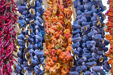 Dried Peppers and Eggplants Hanging in Market