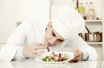 Male is evaluating prepared dish