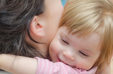 close-up, baby girl hugging with mom