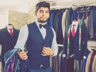 Customer is demonstrating image in waistcoat with butterfly