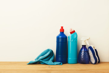 Group of blue cleaning products on white background