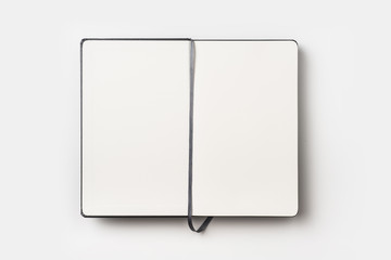 Business concept - Top view of black fly black notebook front with bookmark on background for mockup