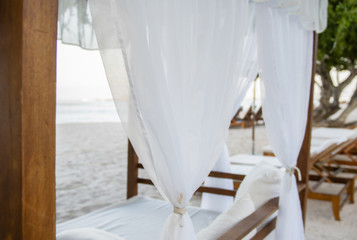 Fototapeta na wymiar Cabana with White Curtains on a Beautiful Beach in Mexico